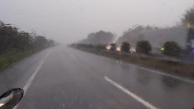 highway driving in heavy rain