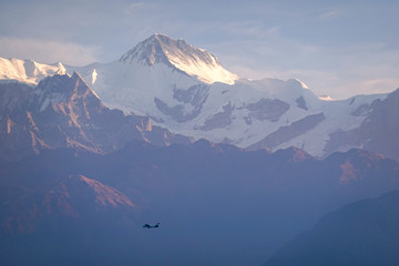 Airplane in the Himalaya Mountains