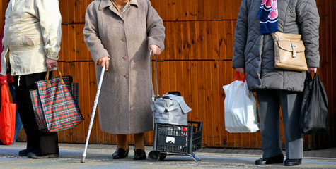Old women are waiting for the bus