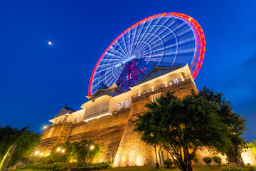 Fototapeta premium Sun wheel In Halong Park in night, Quang Ninh province, Vietnam