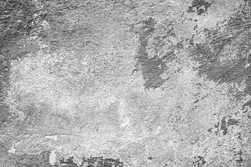 Texture of a concrete wall with cracks and scratches which can be used as a background