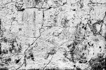 Texture of a concrete wall with cracks and scratches which can be used as a background