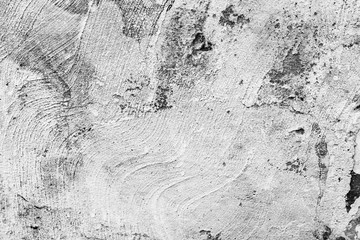 Texture of a concrete wall with cracks and scratches which can be used as a background