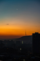 Fototapeta na wymiar Dramatic sunrise over Tbilisi downtown