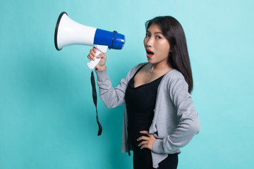 Beautiful young Asian woman announce with megaphone.