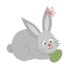 Vector illustration of cute bunny with colored egg isolated on white background. Easter traditional animal and design element. Cute spring icon picture..