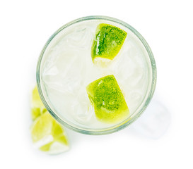 Caipirinha isolated on white background (selective focus; close-up shot)
