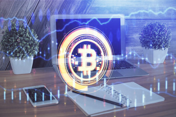Double exposure of blockchain theme hologram and table with computer background. Concept of bitcoin...