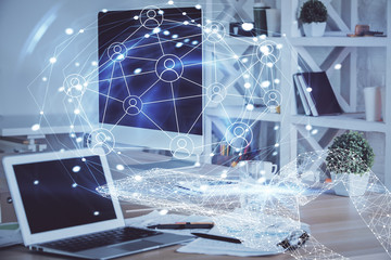 Computer on desktop with social network theme icon. Multi exposure. Concept of international connections.