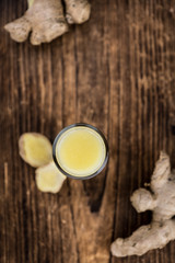 Some fresh Ginger Drink (selective focus; close-up shot)