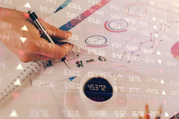 Multi exposure of man planing investment with stock market forex chart.