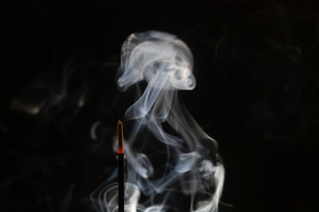 abstract background of smoke from incense stick close up with copy of space on black background