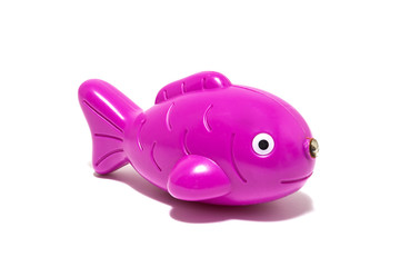 Plastic fish toy isolated on white background.