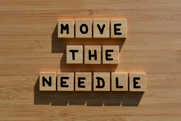 Move The Needle, words on wood