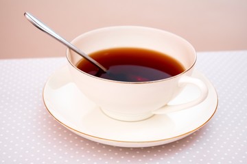 tea in a white cup on a saucer
