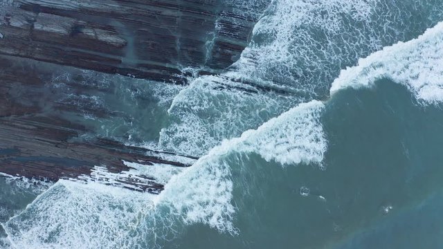 Zumaia and Deba flysch geological strata layers drone aerial view, Basque Country