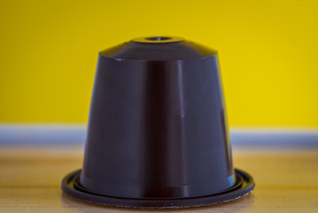 closeup lateral view of an aromatic, tasty espresso coffee capsule