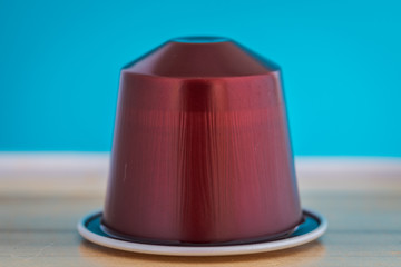 closeup lateral view of an aromatic, tasty espresso coffee capsule