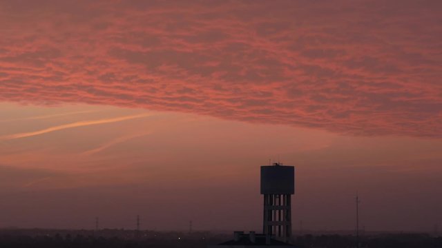 Town watertank time laspe at sunset clouds - Portugal