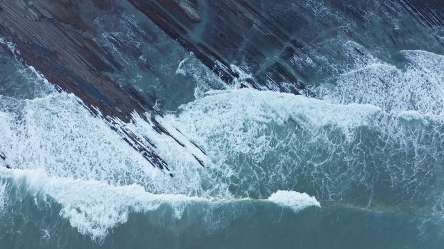 Zumaia and Deba flysch geological strata layers drone aerial view, Basque Country