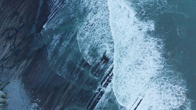 Zumaia and Deba flysch geological strata layers drone aerial view, Basque Country
