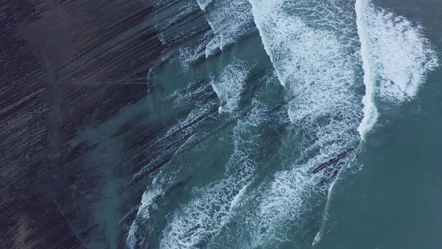 Zumaia and Deba flysch geological strata layers drone aerial view, Basque Country