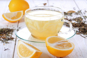 Lemons and lemon drink on a white wooden table
