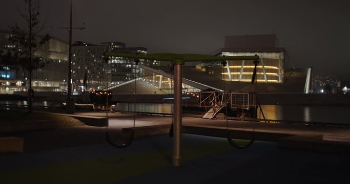 Stabilized full angle 4K shot with slow parallax motion of illuminated Norwegian Opera House and the Edvard Munch Lambda gallery, at night in Bj&oslash;rvika Oslo Norway. Shot on professional cinema camera.