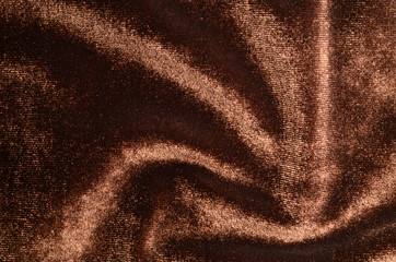 Velvet background: beautifully folded brown velveteen, comet tracery