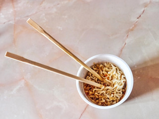 Japanese noodles in the kitchen in a glass japanese chopsticks
