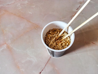 Japanese noodles in the kitchen in a glass japanese chopsticks