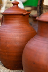 Fototapeta na wymiar clay jug brown large traditional container oil storage wine close-up