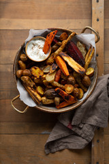 Oven baked roots in vintage pan, carrots and beets