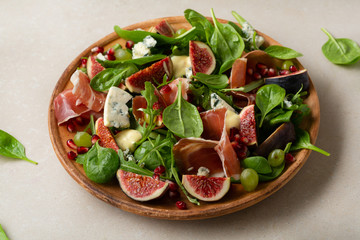 Fresh salad with figs and cheese, food close-up