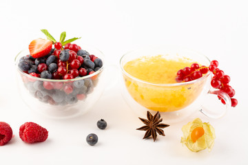 Fruits and berry tea in two cups