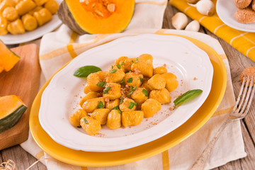 Pumpkin gnocchi with grated amaretti cookies.	