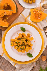 Pumpkin gnocchi with grated amaretti cookies.	