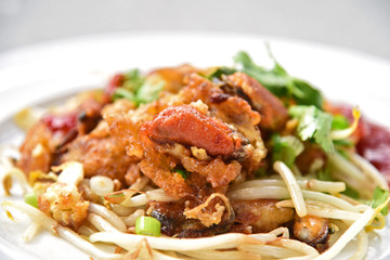  Crisp fried mussel pancakes or Mussel omelette with Sprouts (Thai name is Hoi Tod). famous Street food in Thaiand.