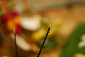 Incense stick and smoke from incense burning. Beautiful smoke. Blurred background and design with copy space. Indian prayer light