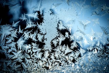 Abstract background with winter frosty patterns on the window