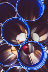 looking through some blue tubes