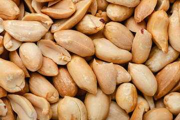  Closeup of roasted shelled peanuts, food background
