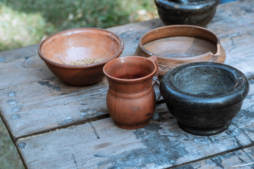 pair earthenware dishes pot rustic dishes natural material background rustic on a wooden table