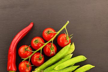 assorted vegetables fresh tasty chilli pepper long red tomato green peas pod closeup