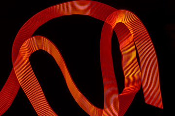 traces of red light on dark background