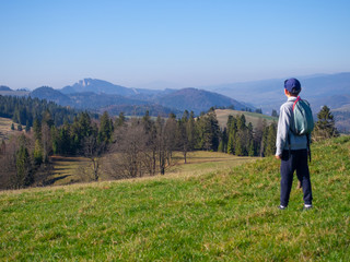 Boy looking at Trzy Korony Massif in Pieniny Mountains