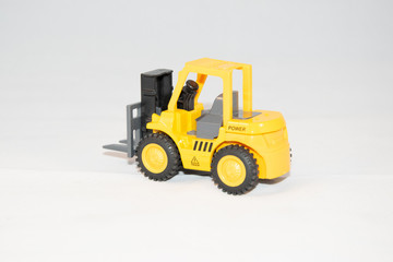 yellow forklift on the white background