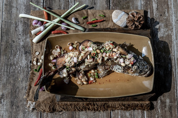 Deep fried whole Snakehead with spicy lemongrass salad, Food for health.