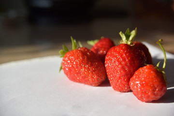 Fresh isolated strawberry on the table