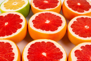 Fototapeta na wymiar Pomelo and grapefruit slices background.